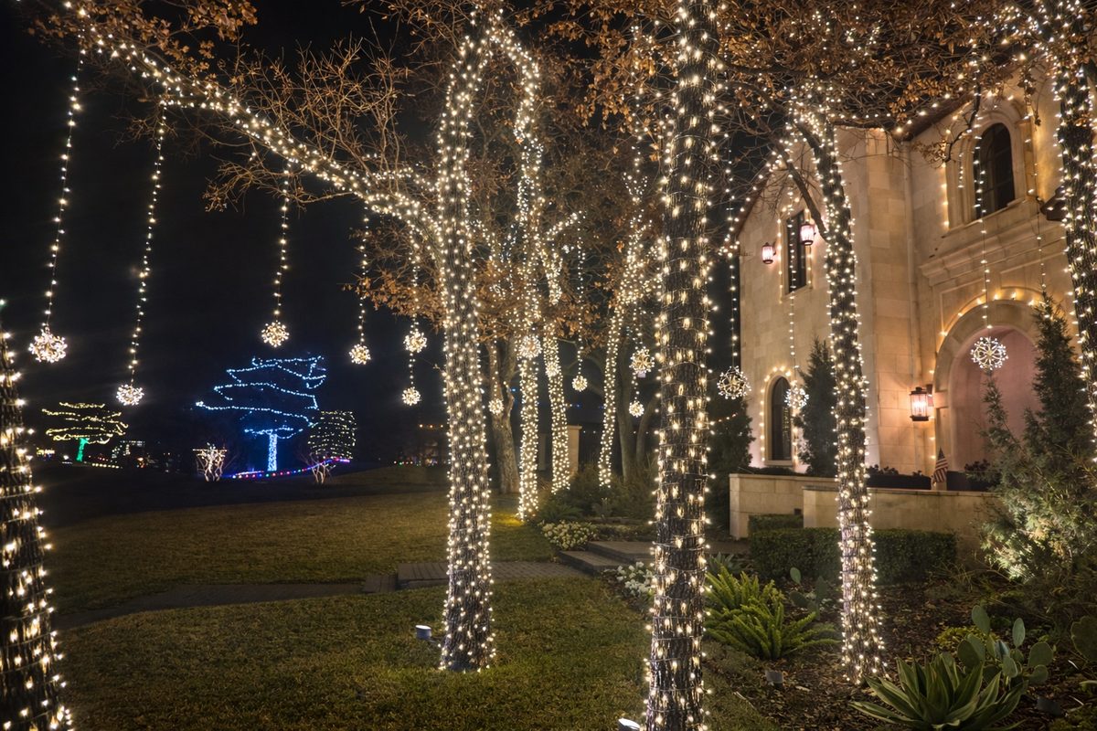 Roofline and landscape holiday lighting on a high-end property